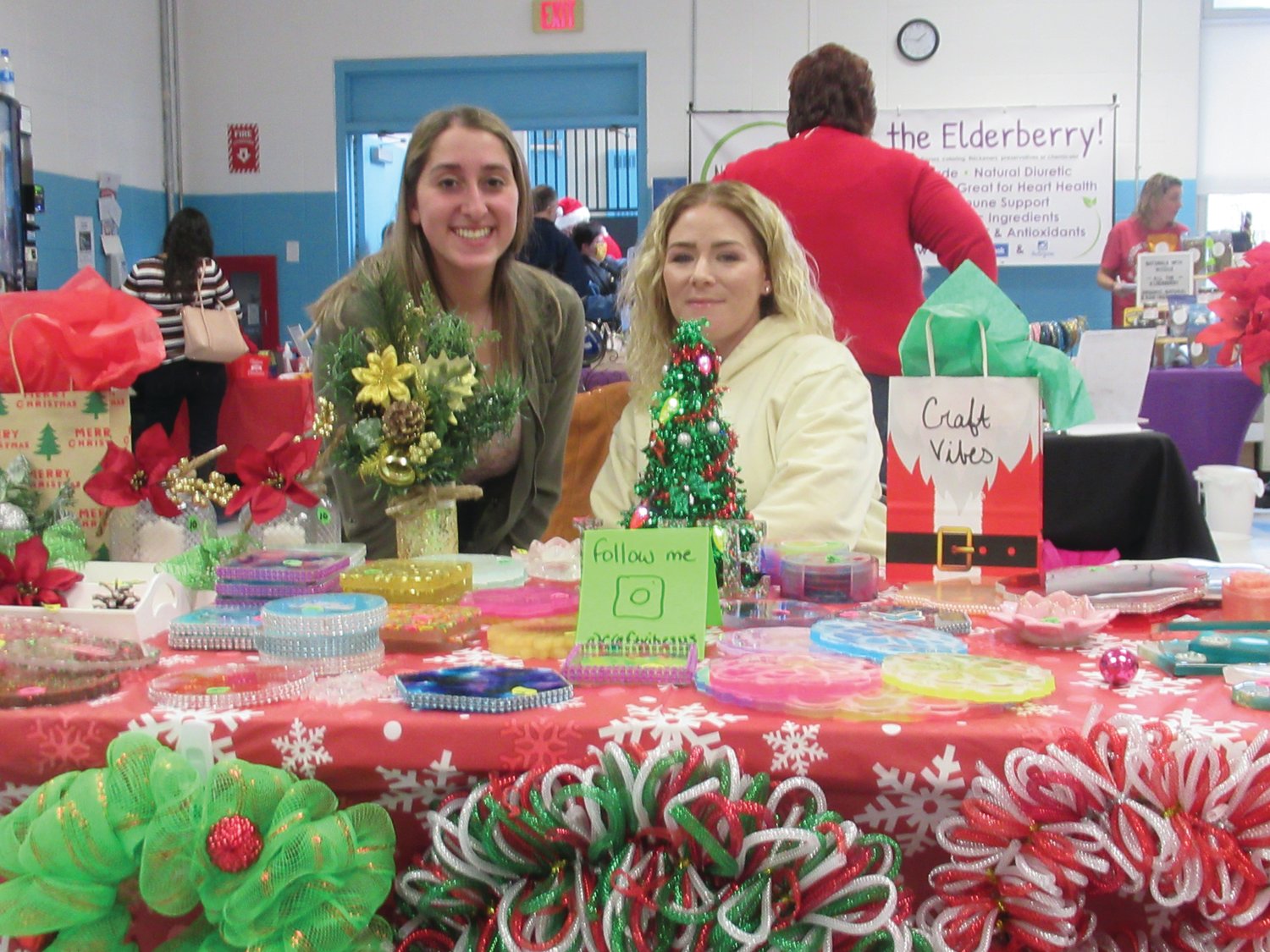 CLASSIC CRAFTS: Chris LaPierre and Alizabeth Almeida set up their Craft Vibes booth during Saturday’s Johnston PTSO Holly Fair.